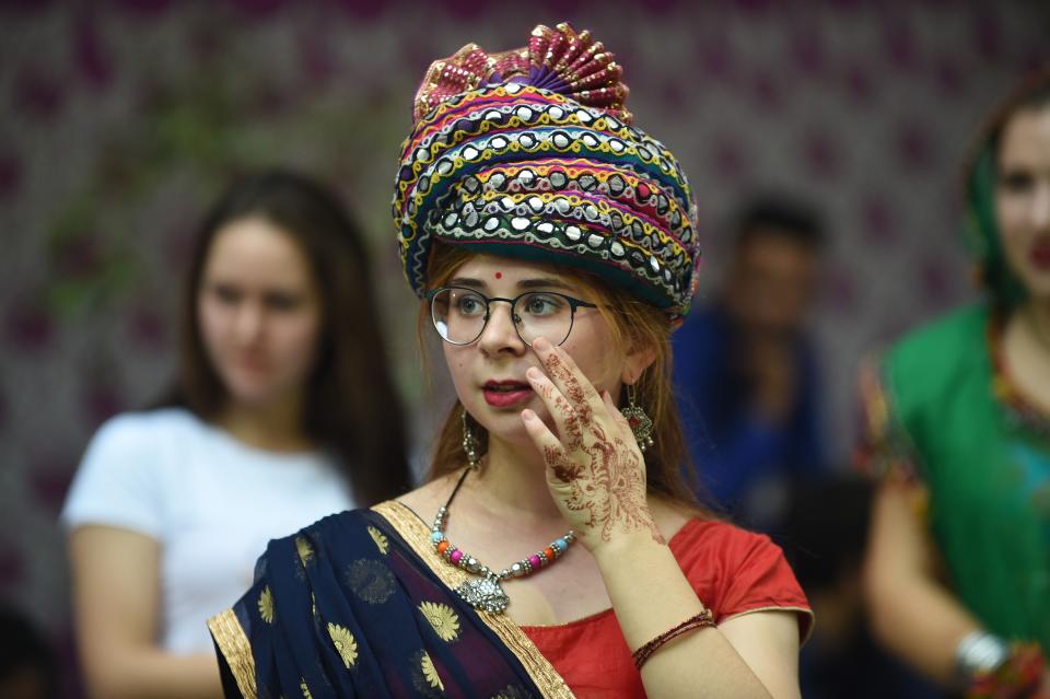 An international student takes part in dance lessons to practice the "Garba For Global Peace" in Ahmedabad, India presented by the AFS Intercultural Programs India.