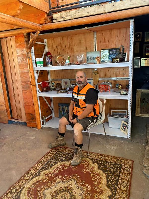 Mario Sepulveda, one of the 33 Chilean miners who were trapped for 69 days underground in a copper and gold mine, poses for a picture during a Reuters interview, in Santiago