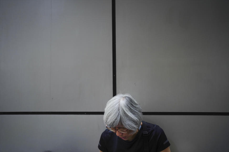 A protester takes part in a sit in outside police headquarters during a protest in Hong Kong, Saturday, Oct. 12, 2019. The protests that started in June over a now-shelved extradition bill have since snowballed into an anti-China campaign amid anger over what many view as Beijing's interference in Hong Kong's autonomy that was granted when the former British colony returned to Chinese rule in 1997. (AP Photo/Vincent Yu)
