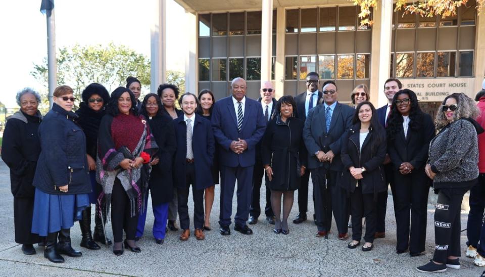 Conley Monk Jr. (center) and other Monk family members pose with the Yale Law School Veterans Legal Services Clinic team, which is working on his behalf. (Photo credit: Conley Monk III)