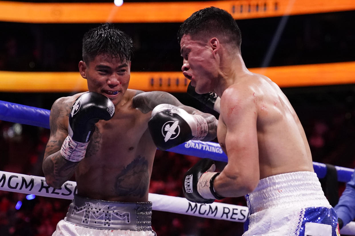 Mark Magsayo, of the Philippines, connects with a punch on Julio Ceja, of Mexico, in a featherweight boxing match Saturday, Aug. 21, 2021, in Las Vegas. (AP Photo/John Locher)