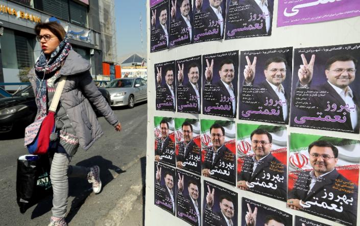 Almost 54,915,024 people are eligible to vote during Iran's upcoming parliamentary elections (AFP Photo/ATTA KENARE)