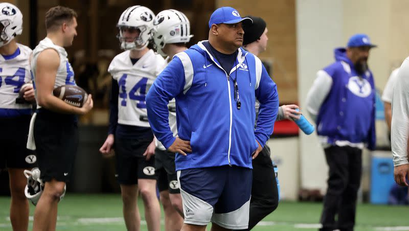BYU coach Kalani Sitake watches players practice during opening day of BYU spring football camp at the BYU Indoor Practice Facility in Provo, on Monday, March 6, 2023. Sitake said one thing he wants to determine during spring drills is which players deserve spots on the two-deep chart.
