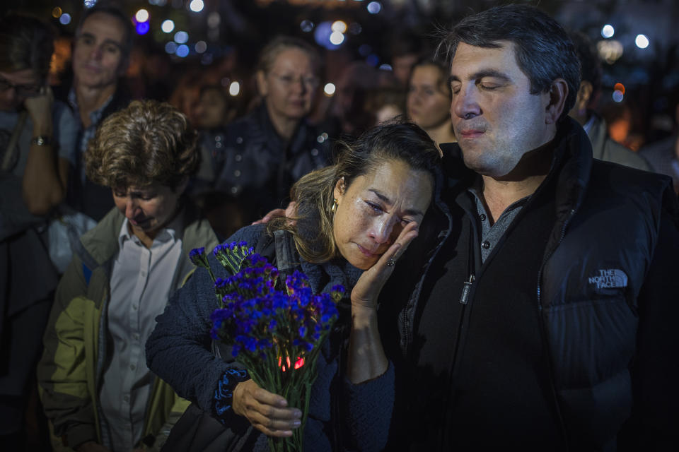 <p>A woman cries as people gather to remember the victims of the recent truck attack during a candle light walk along the Hudson River near the crime scene on Thursday, Nov. 2, 2017, in New York. (Photo: Andres Kudacki/AP) </p>