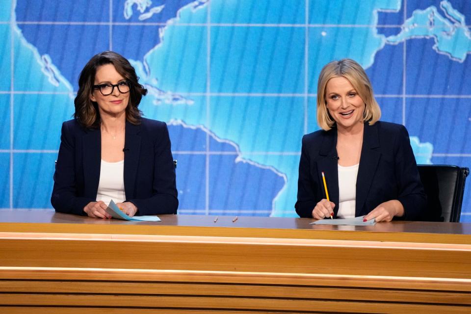 Tina Fey, left, and Amy Poehler praised Rihanna's Super Bowl halftime show for getting everyone "pregnant."