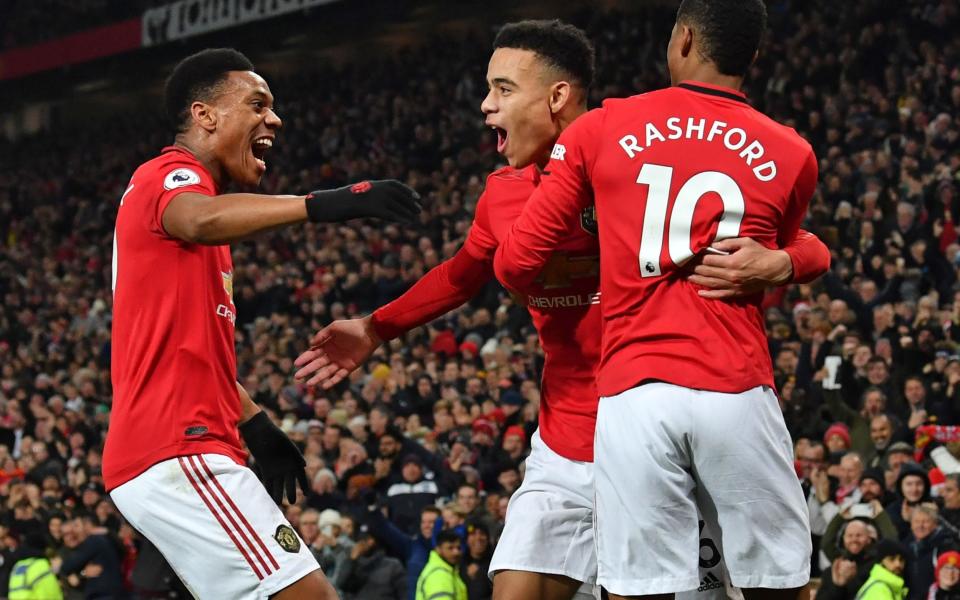 Manchester United's youthful attack of Marcus Rashford (right), Anthony Martial (left) and Mason Greenwood (centre) have 39 goals between them this season - AFP