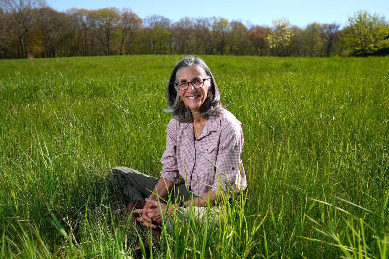 Diane Lynch, president of Rhode Island Food Policy Council, in a hay field she farms at her East Greenwich home.