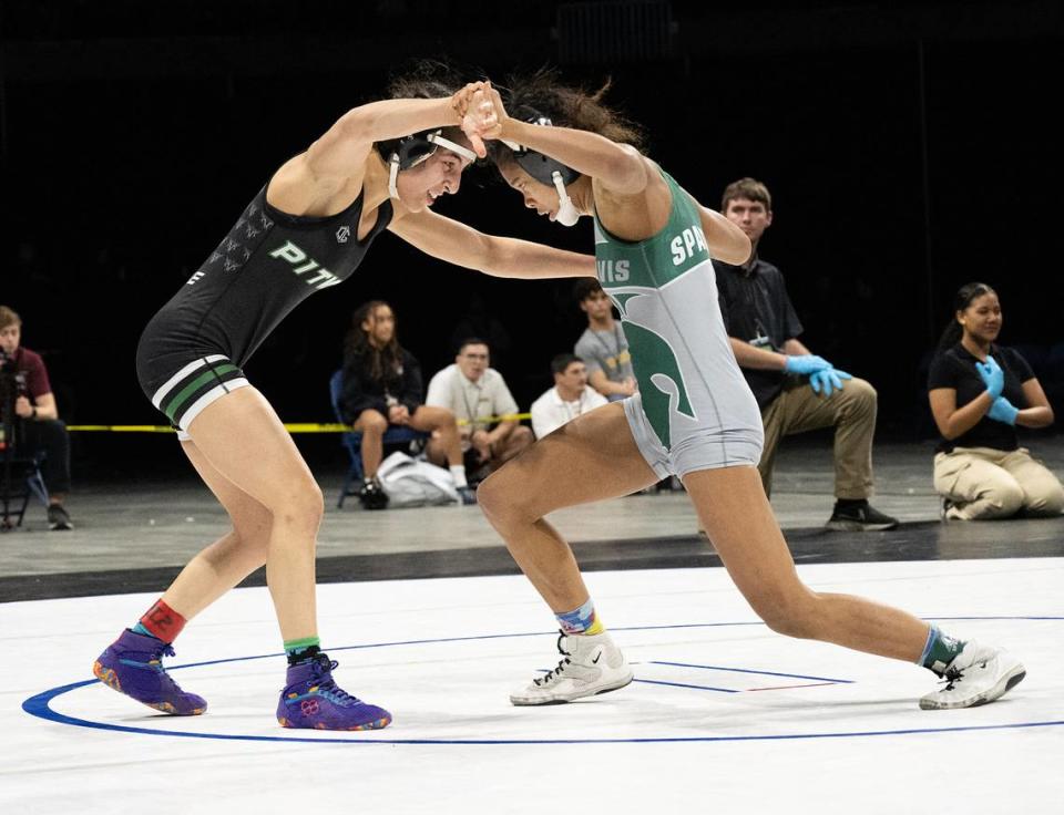 Pitman’s Lexie Capote of Pitman, left, and Jazmine Turner of Grace Davis wrestle in the 105-pound title match during the Sac-Joaquin Section Masters Wrestling Championships at Stockton Arena in Stockton, Calif., Saturday, Feb. 17, 2024. Capote won the match 7-3.