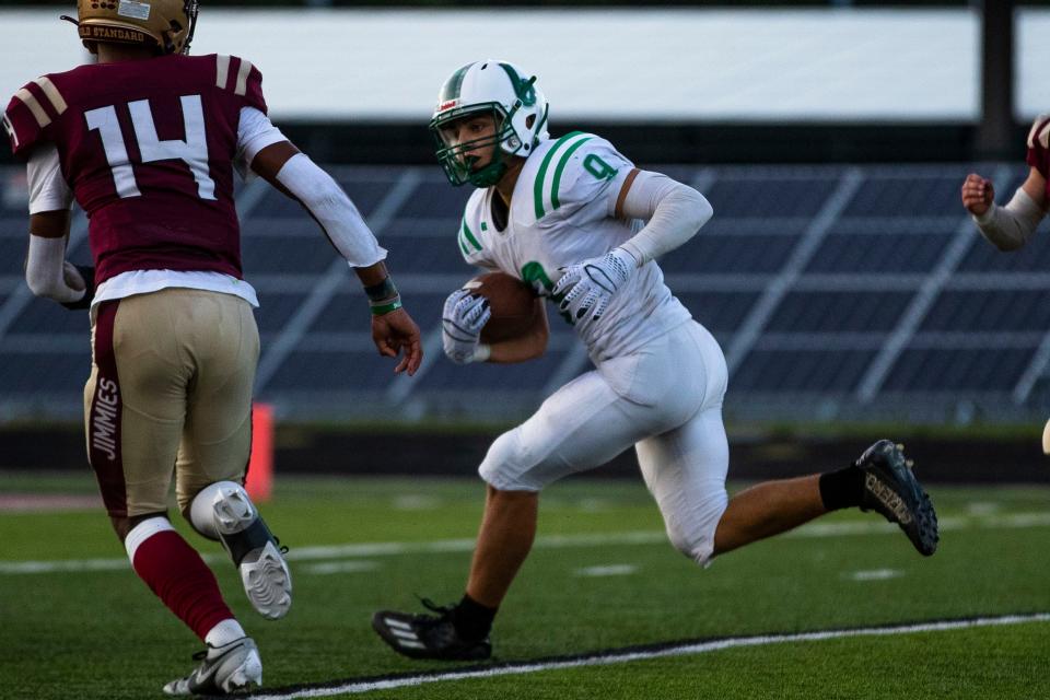 Bremen's Tyrus Graverson (9) runs with the ball during the Bremen vs. Jimtown football game Friday, Sept. 15 at Jimtown High School in Elkhart.