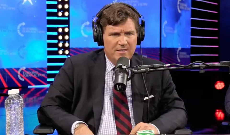 Tucker Carlson during a live discussion hosted by Tim Pool at Turning Point USA’s AmericaFest (YouTube / Tim Pool)