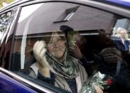 Belarussian author Svetlana Alexievich drives away after attending a news conference in Minsk, Belarus, October 8, 2015. REUTERS/Vasily Fedosenko