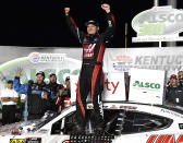 Cole Custer raises his hands in victory following the NASCAR Xfinity Series auto race at Kentucky Speedway in Sparta, Ky., Friday, July 12, 2019. (AP Photo/Timothy D. Easley)