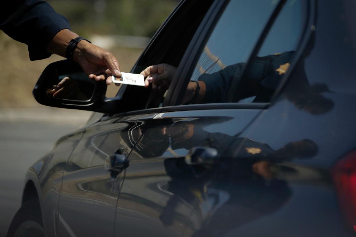 A California Highway Patrol officer stops a motorist who was suspected of speeding along Interstate 405 freeway on April 23, 2020, in Westminster, Calif. California law enforcement was more than twice as likely to use force against people they perceived as Black during vehicle and pedestrian stops in 2021, as compared to people believed to be white, according to a state report.