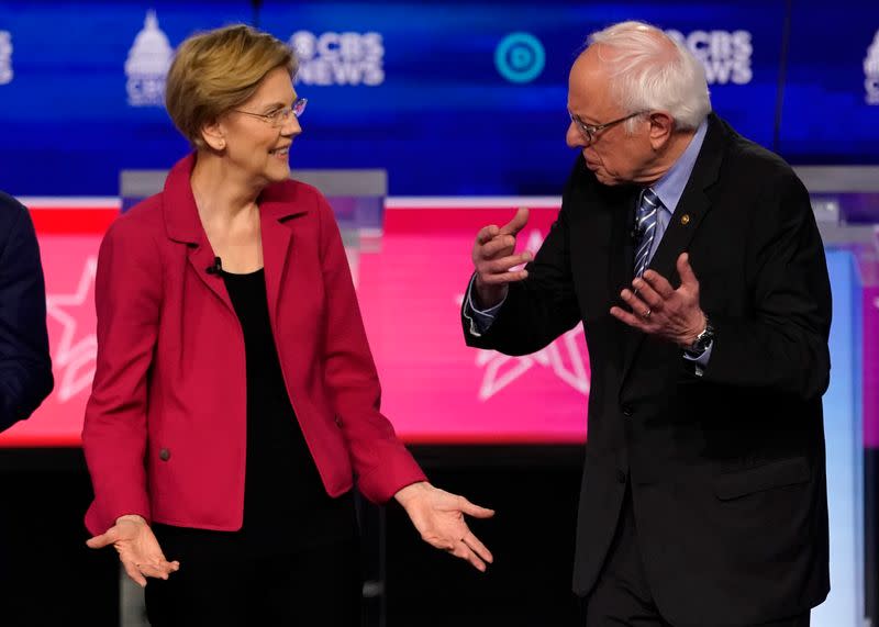 Democratic 2020 U.S. presidential candidates Senator Elizabeth Warren and Senator Bernie Sanders talk before the tenth Democratic 2020 presidential debate at the Gaillard Center in Charleston