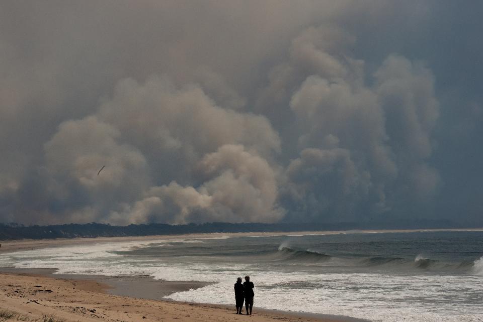 Smoke from nearby bushfires fills the sky over Diamond Beach on the Mid North Coast of NSW.