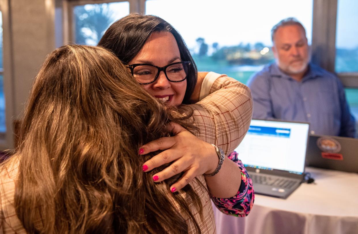 Kimbley Craig hugs a friend during her viewing party as she waits for the results for the Monterey County Board of Supervisors District 2 seat in Salinas, Calif., on Tuesday, June 7, 2022. 