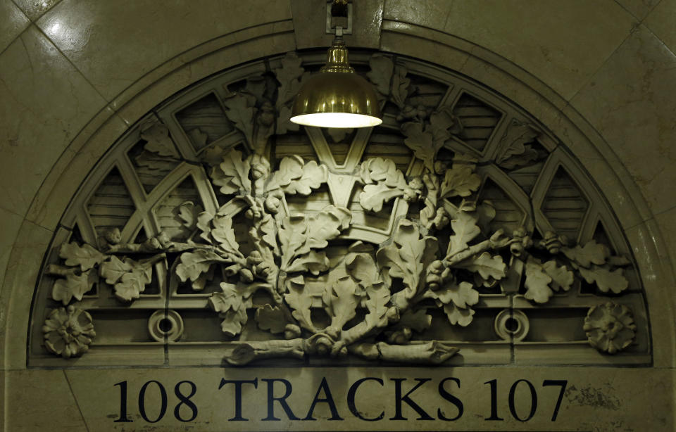 Built by the Vanderbilts, railroad barons and industrialists who were among America's richest and most powerful families, track entrances are adorned by acorns and oak leaf clusters, the family's symbols, at Grand Central Terminal in New York, Tuesday, Jan. 8, 2013. The country's most famous train station and one of the finest examples of Beaux Arts architecture in America turns 100 on Feb. 1. (AP Photo/Kathy Willens)