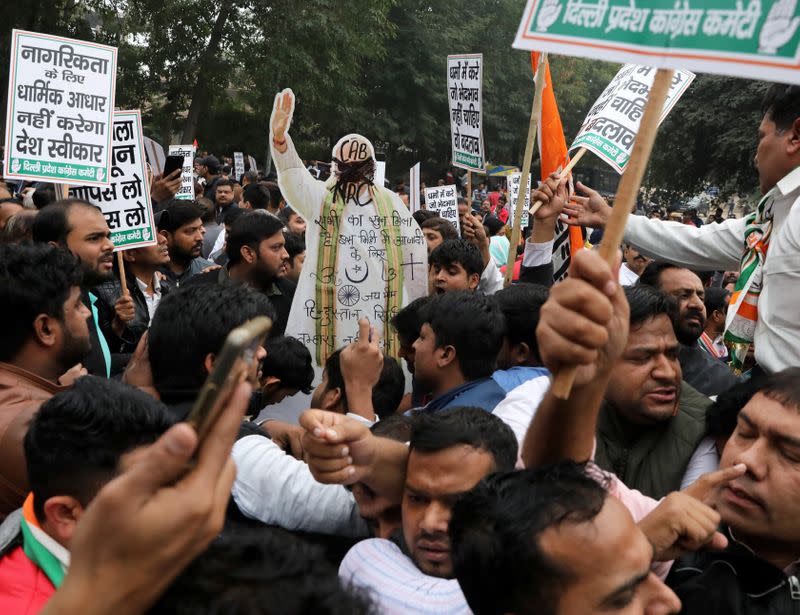 Supporters of India's main opposition Congress party carry a cutout depicting India's Home Minister Amit Shah during a protest against the Citizenship Amendment Bill, in New Delhi