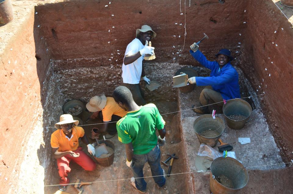 Crew members excavate artifacts at a site in Karonga, Malawi, where stone tools are buried more than 3 feet (1 meter) below the modern ground surface. Jessica Thompson, <a href="http://creativecommons.org/licenses/by-nd/4.0/" rel="nofollow noopener" target="_blank" data-ylk="slk:CC BY-ND;elm:context_link;itc:0;sec:content-canvas" class="link ">CC BY-ND</a>