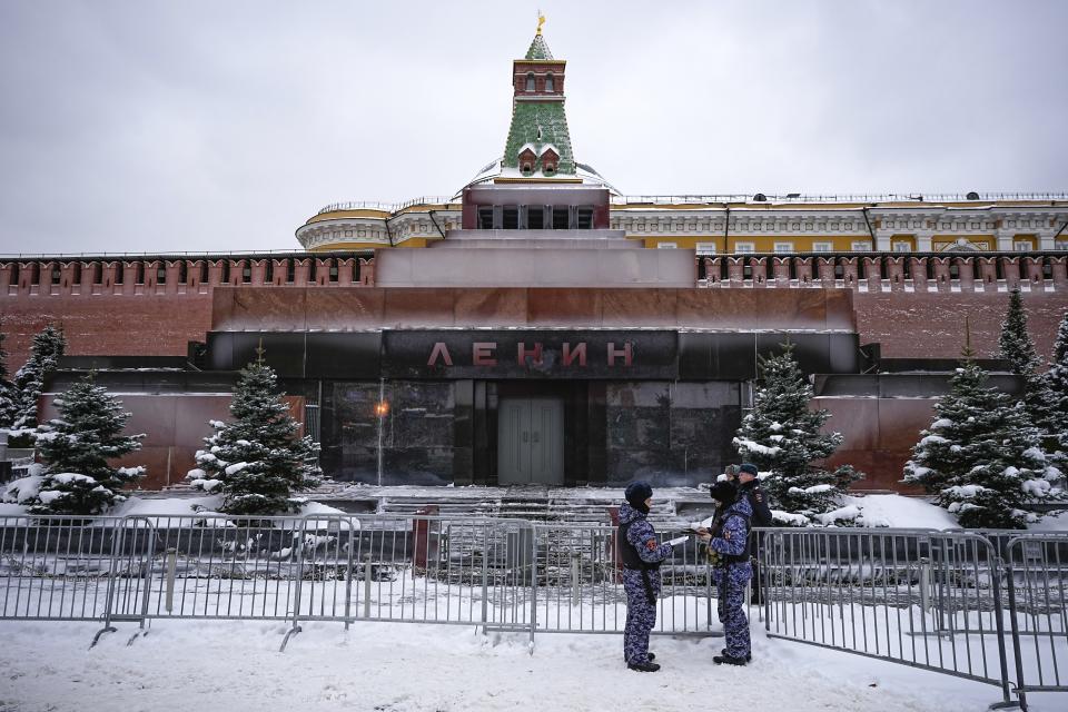 Rosguardia, or National Guard, servicemen stand in front of the Red Square mausoleum of Vladimir Lenin, the founder of the Soviet Union, on in Moscow, Russia, Tuesday, Jan. 16, 2024. The mausoleum where his embalmed corpse lies in an open sarcophagus is open only 15 hours a week and draws far fewer visitors than the Moscow Zoo. (AP Photo/Alexander Zemlianichenko)
