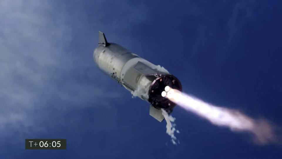 In this image from video made available by SpaceX, one of the company's Starship prototypes fires its thrusters as it lands during a test in Boca Chica, Texas, on Wednesday, March 3, 2021. SpaceX’s futuristic Starship looked like it aced a touchdown Wednesday, but then exploded on the landing pad with so much force that it was hurled into the air. The failure occurred just minutes after SpaceX declared success. (SpaceX via AP)