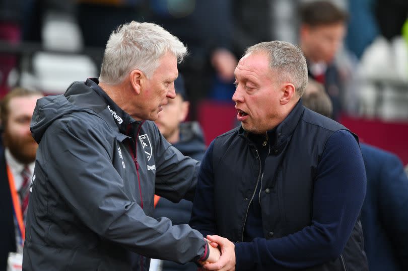 David Moyes, manager of West Ham United greets Steve Cooper, Nottingham Forest head coach