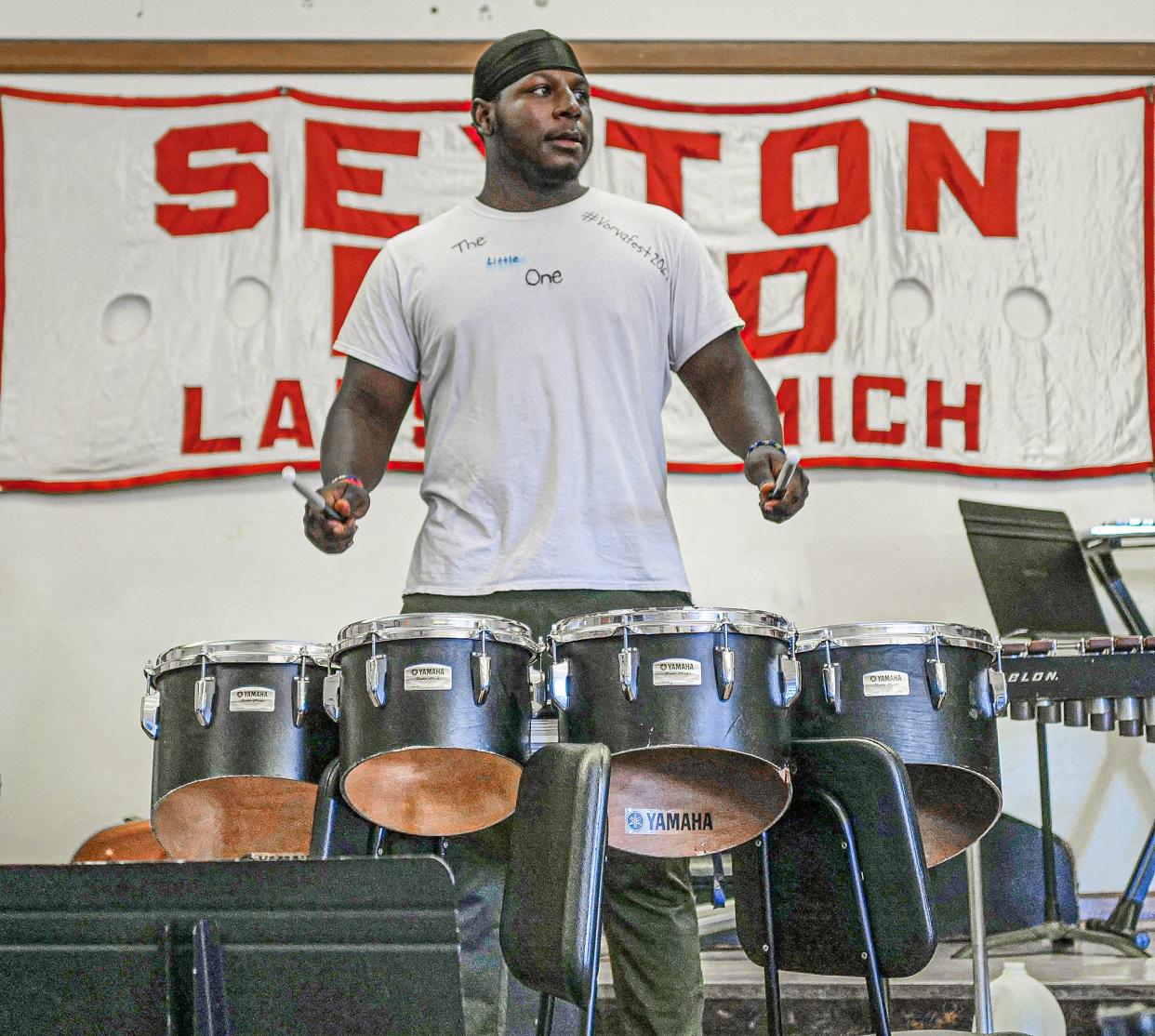 Dayveon Thomas, recent Sexton graduate, practices with the drumline for the Juneteenth parade Friday, June 17, 2022. He plans to become a firefighter once he gets certified.