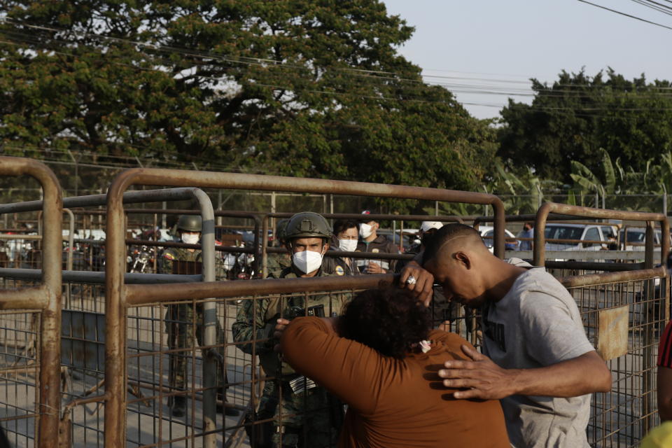 Relatives of prisoners await news outside the Litoral Penitentiary in Guayaquil, Ecuador, Wednesday, September 29, 2021. The authorities report at least 100 dead and 52 injured in a riot on Tuesday at the prison. (AP Photo / Angel DeJesus)