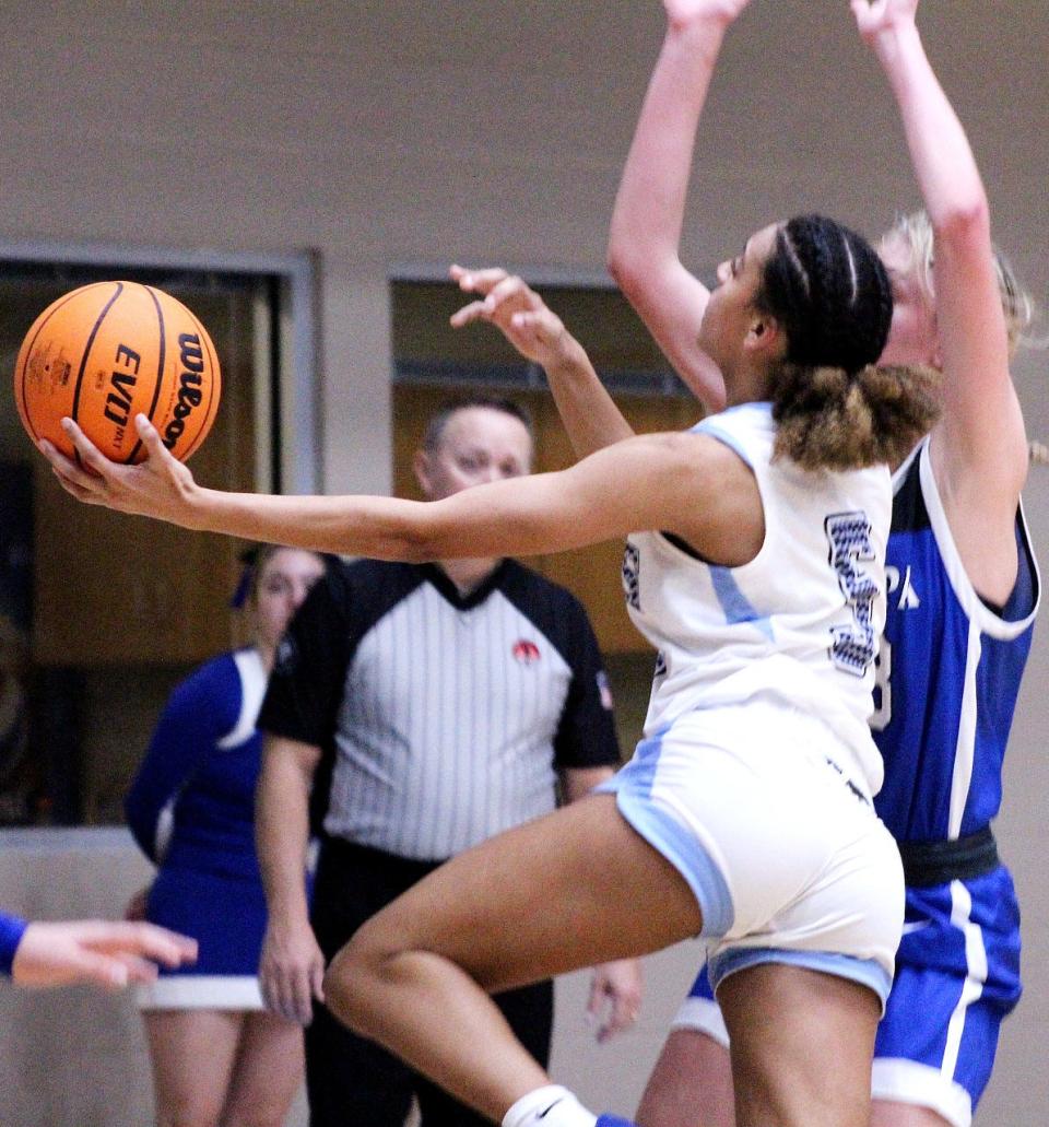 First year Bartlesville High starter Kadance Barnett takes the ball strong to the rim during the girls basketball season home opener on Dec. 2, 2022, against Sapulpa High.