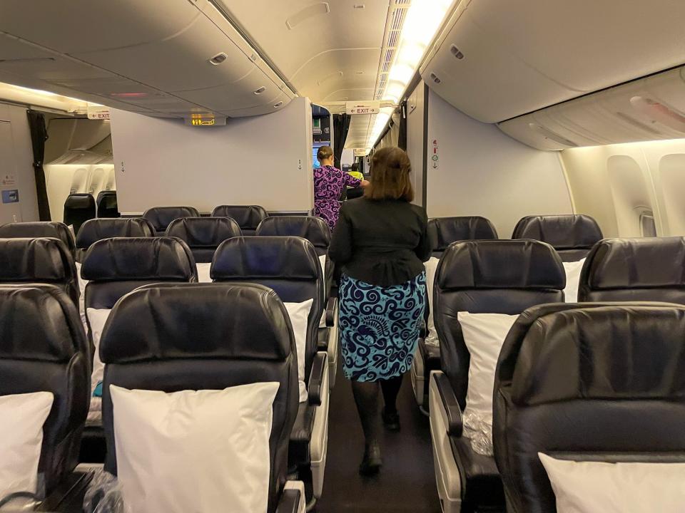 Sarita Rami walks through the cabin on Air New Zealand's Boeing 777-300ER.