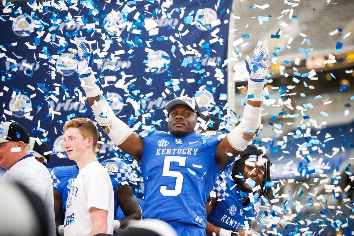 Kentucky linebacker DeAndre Square (5) celebrated with his teammates during the trophy presentation after the Wildcats beat Iowa 20-17 in last season’s Citrus Bowl. This season, UK will be looking for its fifth straight bowl victory.