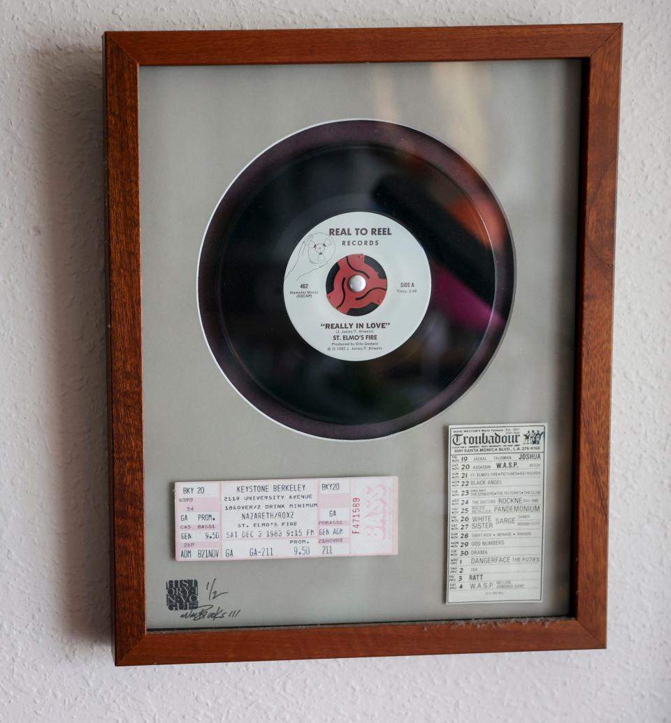 Memorabilia from St. Elmo's Fire hangs on Tim Allwein's wall  in Salem. Allwein was the lead singer of the 80s metal band.