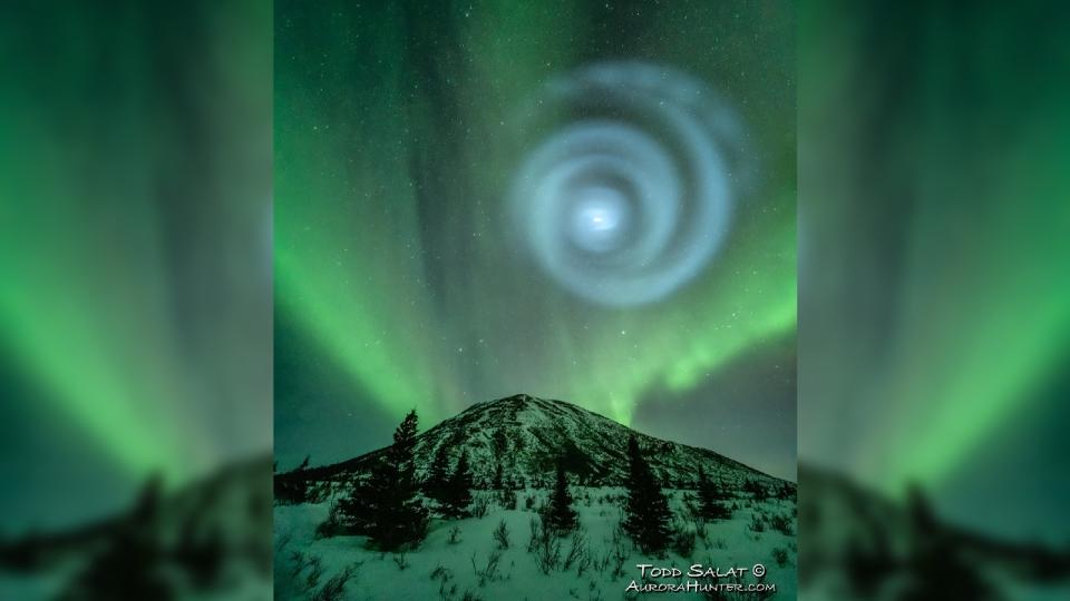 A blue sprial of light in the night sky