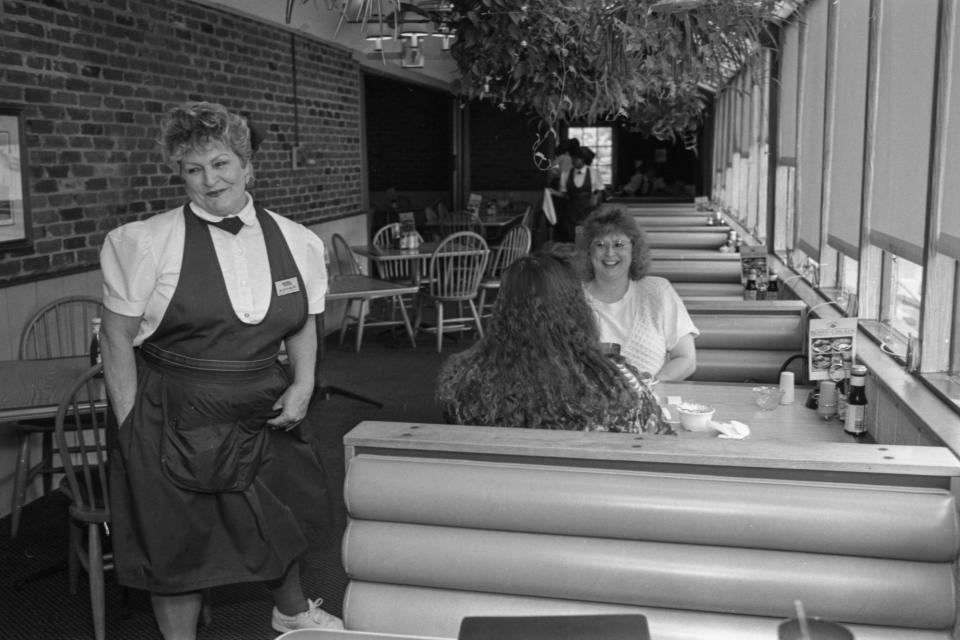 Esther Swiderski, a waitress with Golden Corral for the past 20 years, jokes with Angela Bullard and Monica Jones on May 11, 1994. The pair were sad to learn of the Bragg Blvd. restaurant closing but Angela added "Now I'll have to drive over to the mall."