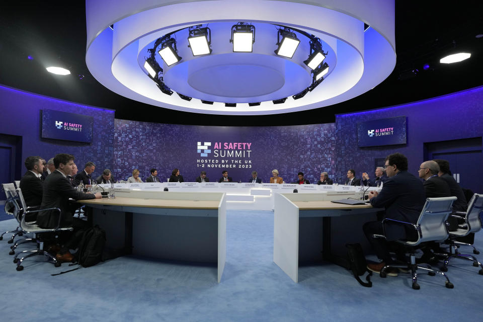 FILE - Delegates sit at a roundtable during a plenary session of the AI Safety Summit at Bletchley Park in Milton Keynes, England, on Nov. 2, 2023. South Korea is set to host a mini-summit this week on risks and regulation of artificial intelligence, following up on an inaugural AI safety meeting in Britain in 2023 that drew a diverse crowd of tech luminaries, researchers and officials. (AP Photo/Alastair Grant, Pool, File)