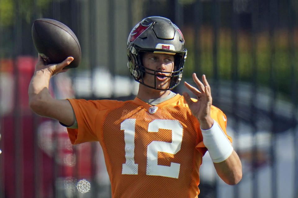 Tampa Bay Buccaneers quarterback Tom Brady (12) throws a pass during an NFL football minicamp Tuesday, June 8, 2021, in Tampa, Fla. (AP Photo/Chris O'Meara)