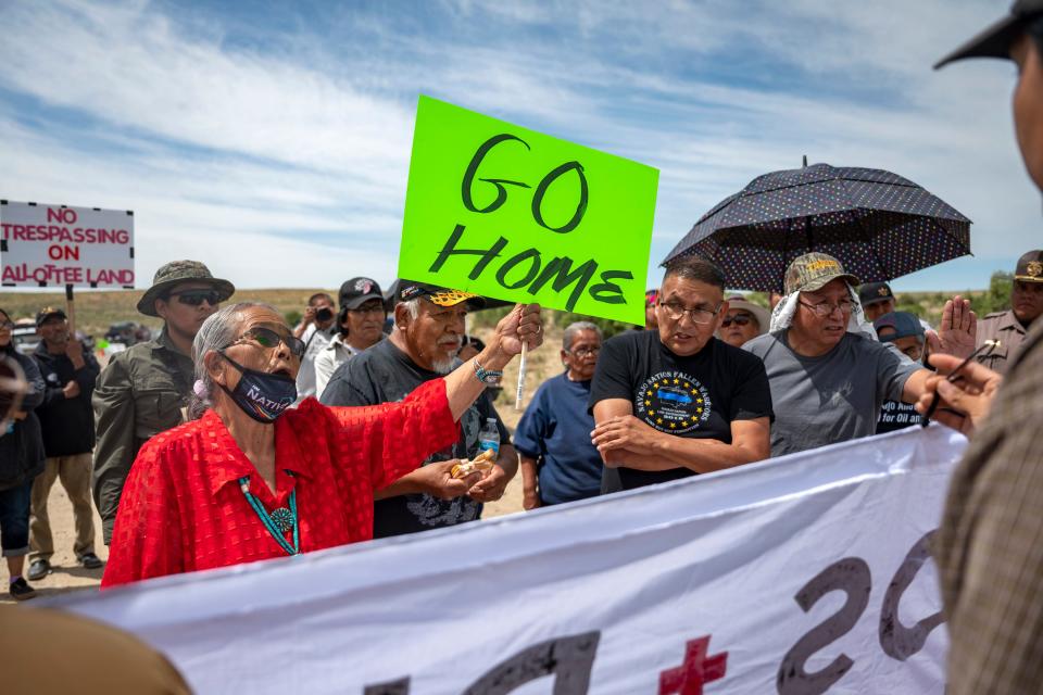 Landowner Paulina Atenico (left) tells activists to "go home" near a roadblock on County Road 7950 east of Chaco Culture National Park on Sunday, June 11, 2023. Opponents and supporters for a buffer zone around Chaco Culture National Park clashed on Sunday after Navajo Allotees blocked a portion of CR 7950 that lead into the park during U.S. Interior Secretary Deb Haaland's planned visit.