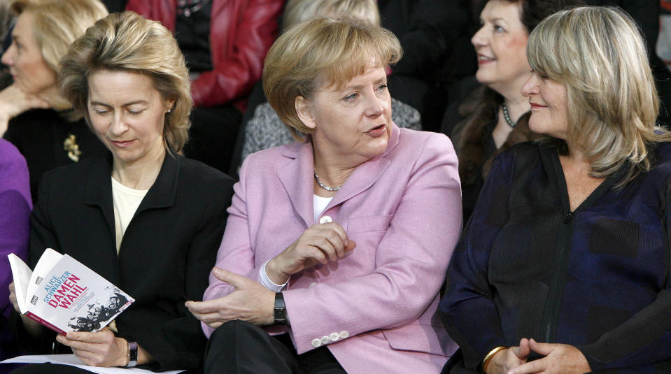 FILE - In this Monday, Jan. 26, 2009 file photo, German Family Minister Ursula von der Leyen, German Chancellor Angela Merkel and the publisher Alice Schwarzer, from left, take part on a '90 years of women's right to vote' morning performance at the chancellory in Berlin, Germany. Millions of women admire the 67-year-old for breaking through the glass ceiling of male dominance in politics, and she’s been lauded as an impressive role model for girls both at home and around the globe. (AP Photo/Michael Sohn, File)