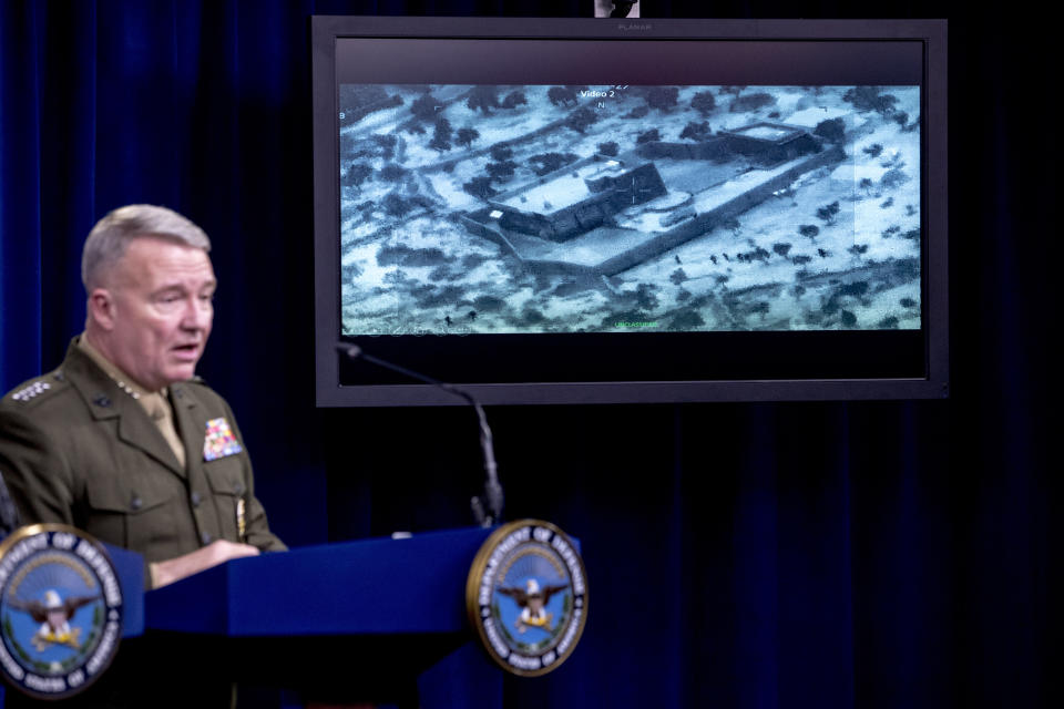 Video of the Abu Bakr al-Baghdadi raid is displayed as U.S. Central Command Commander Marine Gen. Kenneth McKenzie speaks, Wednesday, Oct. 30, 2019, at a joint press briefing at the Pentagon in Washington. (AP Photo/Andrew Harnik)