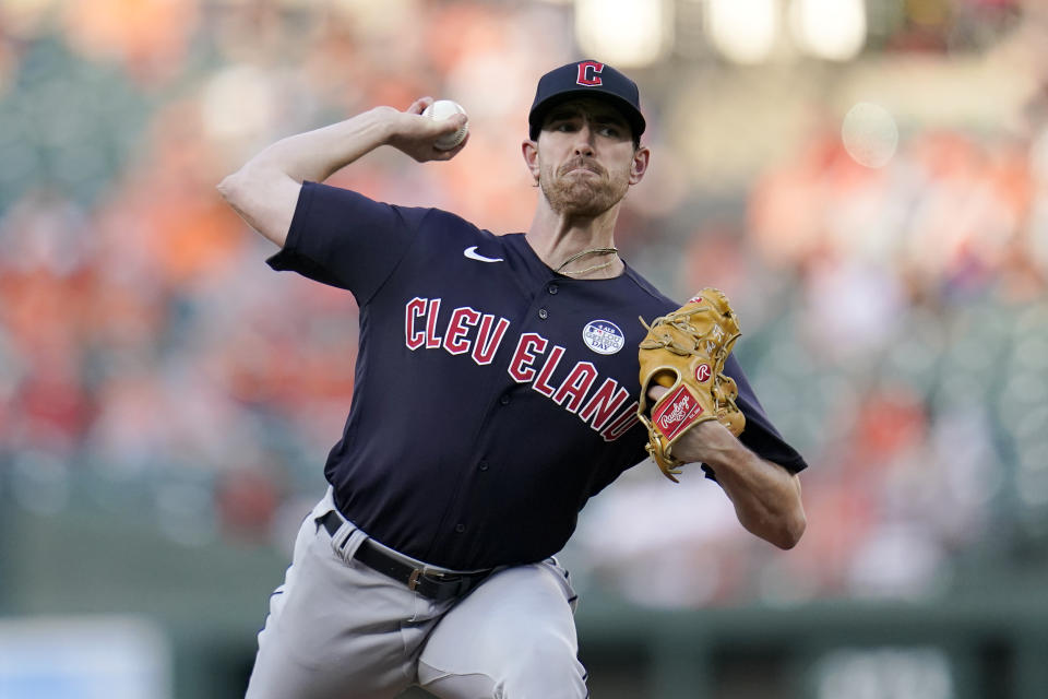 Cleveland Guardians starting pitcher Shane Bieber throws a pitch to the Baltimore Orioles during the first inning of an MLB game