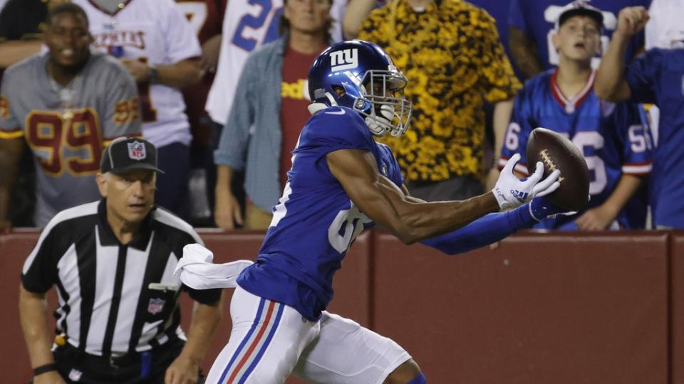 Sep 16, 2021; Landover, Maryland, USA; New York Giants wide receiver Darius Slayton (86) catches a touchdown pass as Washington Football Team cornerback William Jackson III (23) defends in the third quarter at FedExField. Mandatory Credit: Geoff Burke-USA TODAY Sports