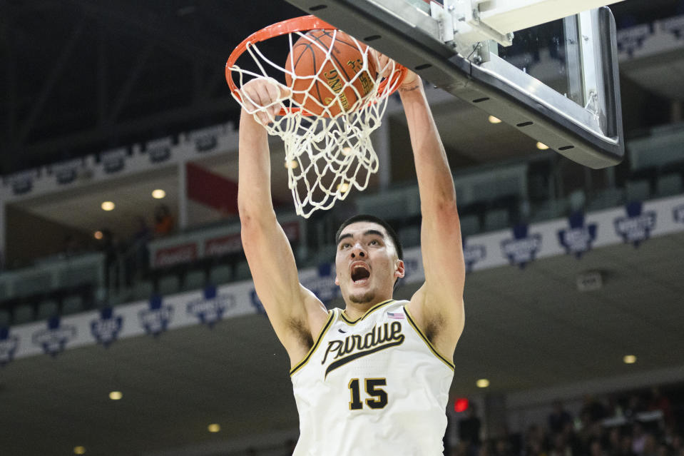 Purdue center Zach Edey (15) dunks during the second half of an NCAA college basketball game against Alabama in Toronto, Saturday, Dec. 9, 2023. (Christopher Katsarov/The Canadian Press via AP)