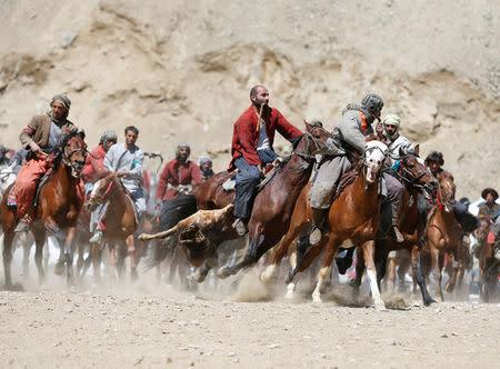 Afghan horsemen compete during a Buzkashi game in Panjshir province, north of Kabul, Afghanistan April 7, 2017. REUTERS/Omar Sobhani