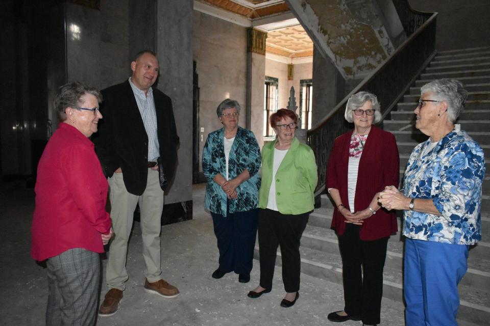 Keith Masserant is shown in the St. Mary Academy foyer with members of the IHM Leadership Council: Mary Jane Herb, Marianne Gaynor, Pat McCluskey, Ellen Rinke and Margaret Chapman