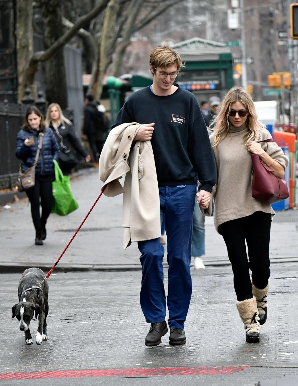 Sienna Miller and Lucas Zwirner step out for a hand-in-hand Tuesday morning stroll with their pup in New York City.