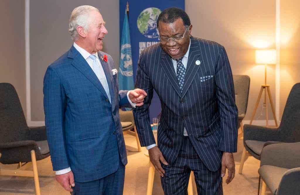 The Prince of Wales greets the President of Namibia Hage Geingob ahead of their bilateral meeting during the COP26 summit (PA)