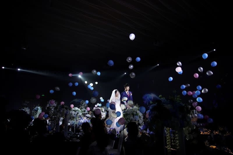 The Wider Image: Coronavirus dampens celebrations in China's wedding gown city