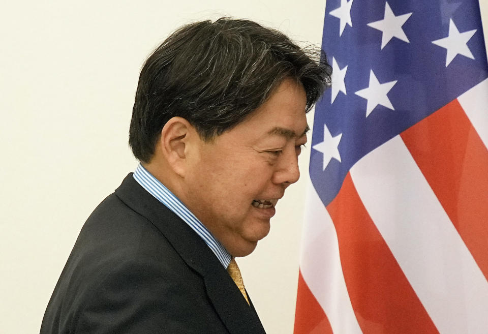 Foreign Minister Yoshimasa Hayashi of Japan walks beside a US flag during meeting United States secretary of state Antony Blinken for bilateral talks at the G7 Foreign Ministers' Meeting in Muenster, Germany, Friday, Nov. 4, 2022. (AP Photo/Martin Meissner, Pool)