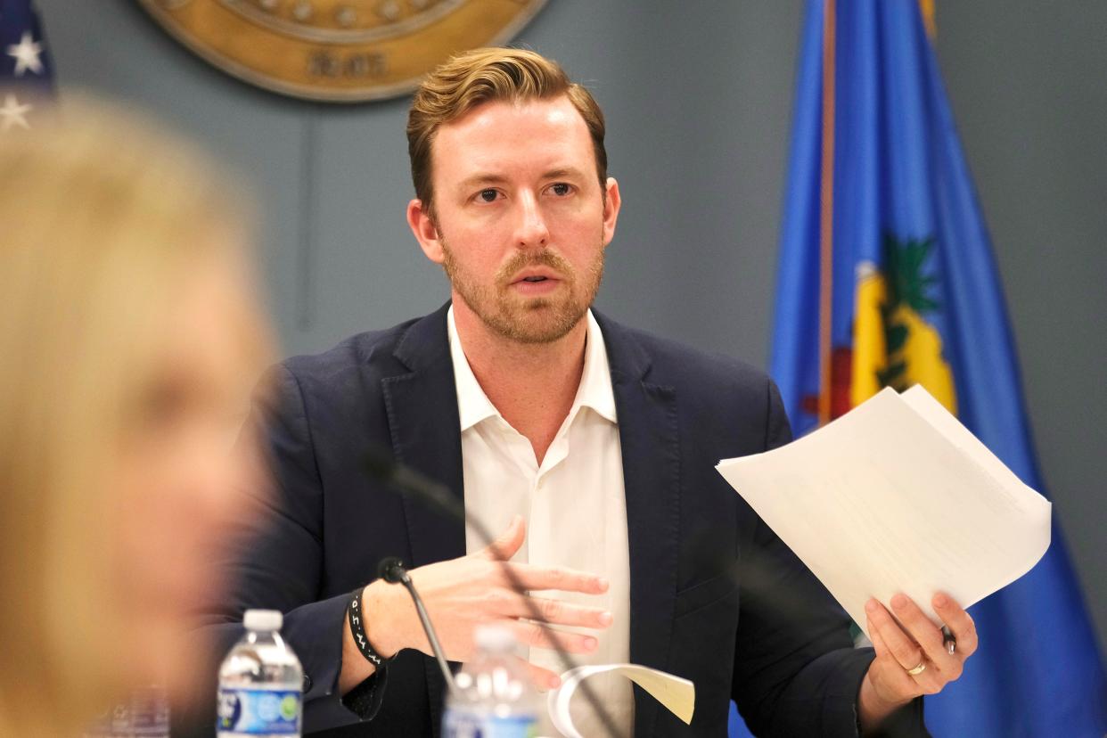 State school Superintendent Ryan Walters looks over material at the February meeting of the Oklahoma state school board, Thursday, Feb. 22, 2024.