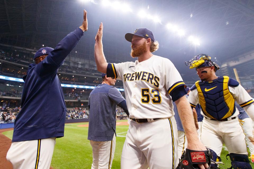 Brandon Woodruff celebrates with teammates after throwing a complete-game shutout against the Miami Marlins on Sept. 11, 2023. Woodruff missed most of last season with a shoulder injury and is expected to be out all of 2024 after having offseason surgery.